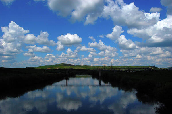 Scenics Poster featuring the photograph Cumulus Clouds Reflecting Over River by Marius Popa