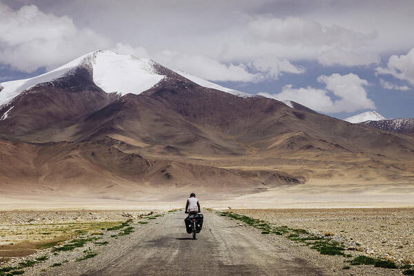 Central Asia Poster featuring the photograph Cycling the Pamir Highway by Kamran Ali