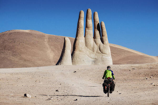 Adventure Poster featuring the photograph Cyclist heading to Hand of the Desert in Atacama Desert, Chile by Kamran Ali