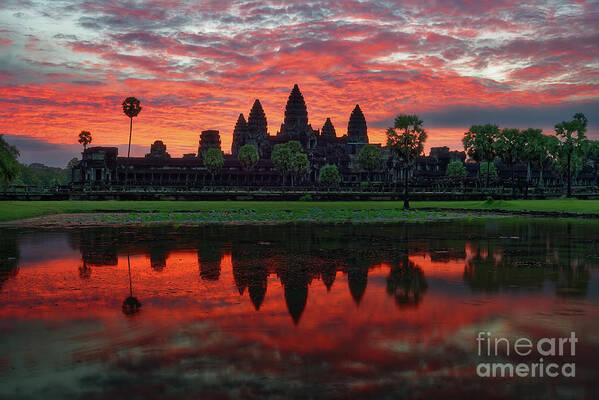 Angkor Wat Poster featuring the photograph Angkor Wat Temple Reflecting in Pond at Sunrise by Tom Schwabel