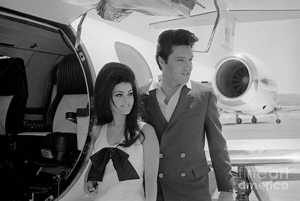 Following Poster featuring the photograph Elvis And Priscilla Presley Posing by Bettmann