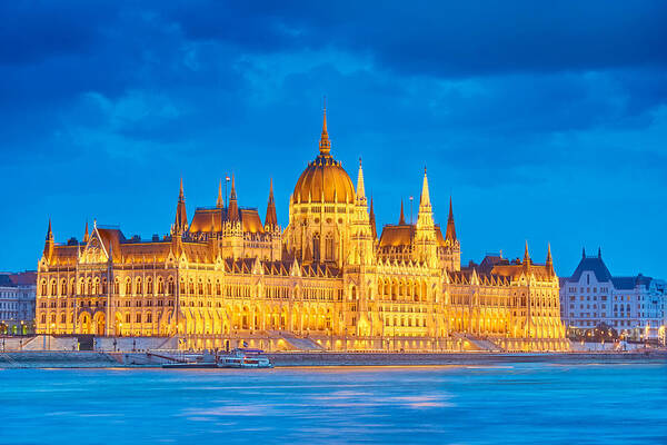 Cityscape Poster featuring the photograph Evening View At Hungarian Parliament by Jan Wlodarczyk