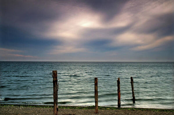 Tranquility Poster featuring the photograph Fence Post And Ocean by Mitch Diamond