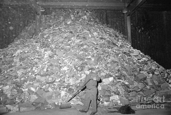 Employment And Labor Poster featuring the photograph Garbage Collector Sweeping Huge Pile by Bettmann
