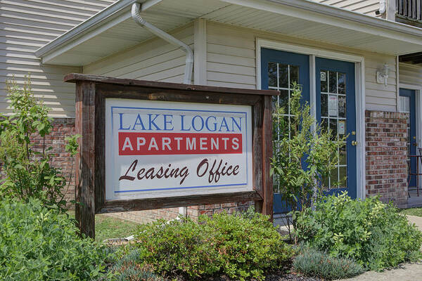 Sign Poster featuring the photograph Lake Logan apartments sign by Jeff Kurtz