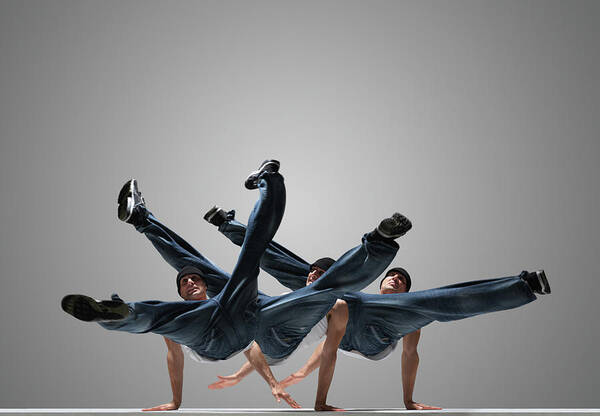 White Background Poster featuring the photograph Male Breakdancer Performing Multiple by John Lamb