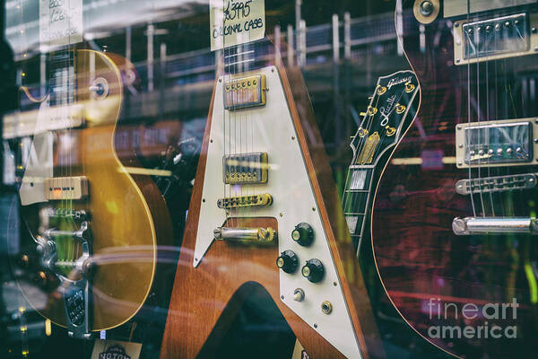 Old Guitars Poster featuring the photograph Old Guitars in a Shop Window by Tim Gainey