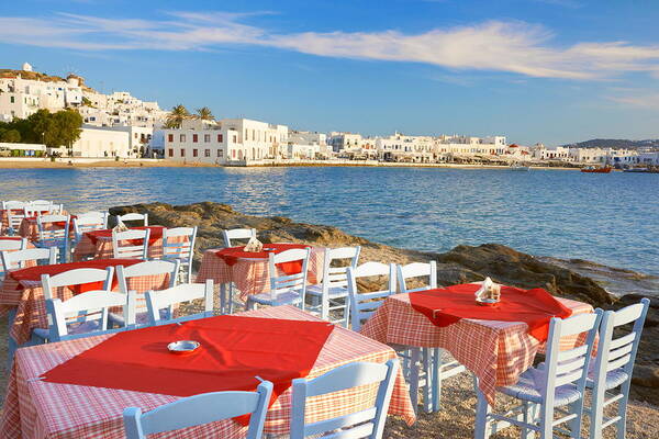 Landscape Poster featuring the photograph Outdoor Restaurant At Mykonos Island by Jan Wlodarczyk