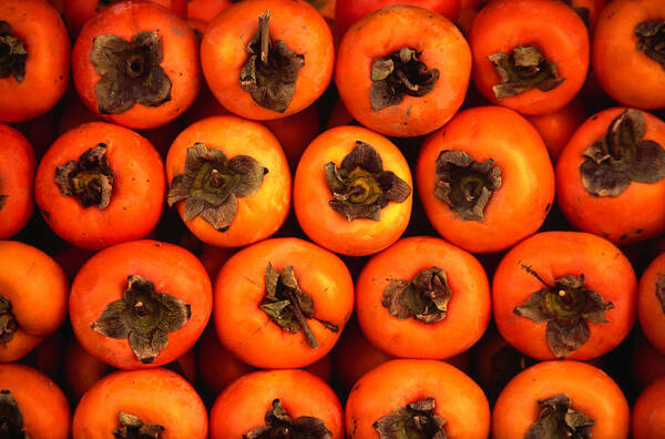 Orange Color Poster featuring the photograph Persimmons From A Stall In The Central by Lonely Planet