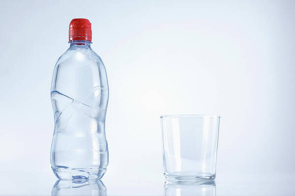 White Background Poster featuring the photograph Plastic Bottle Of Mineral Water With by Westend61