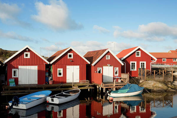 Water's Edge Poster featuring the photograph Red Coastal Houses by Lordrunar