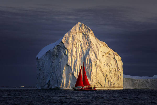 Ilulissat Poster featuring the photograph Red Sailboat And Giant Iceberg At Midnight Ilulissat by Raymond Ren Rong Liu