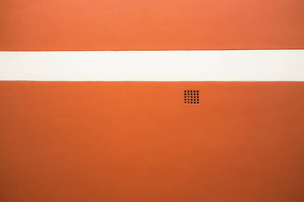 Outdoors Poster featuring the photograph Red Wall With White Stripe And Grate by M. Ivkovic - Bangphoto.co.uk