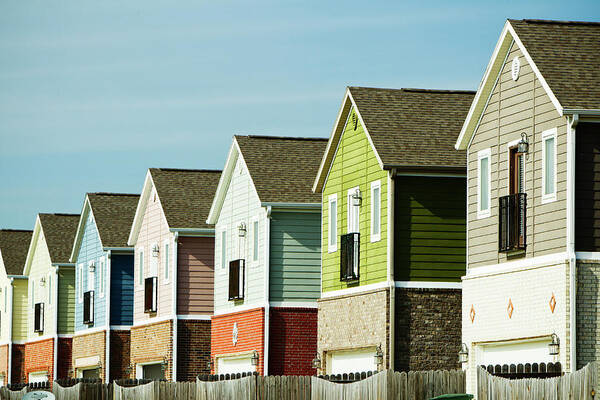 Row House Poster featuring the photograph Row Of Colorful Homes by Wesley Hitt