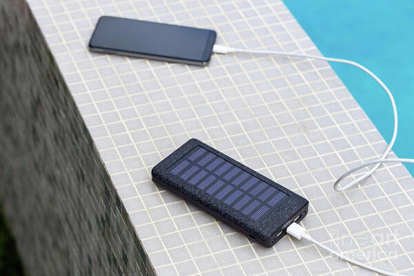 Smartphone Poster featuring the photograph Solar Smartphone Charger by Sakkmesterke/science Photo Library