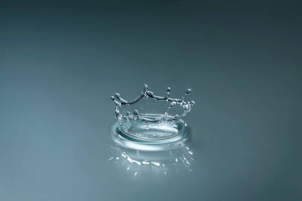 Motion Poster featuring the photograph Splash From A Drop Of Water by Bjorn Holland