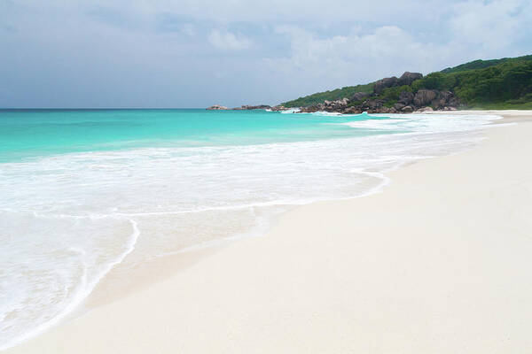 Beach Poster featuring the photograph The Beach With White Sand And Turquoise Water With Waves by Cavan Images