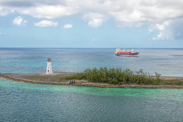 Lighthouse Poster featuring the photograph The Lighthouse and the Freighter by Kristia Adams