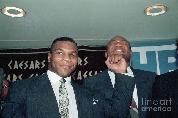 People Poster featuring the photograph Tyson Pretend Punching George Foreman by Bettmann
