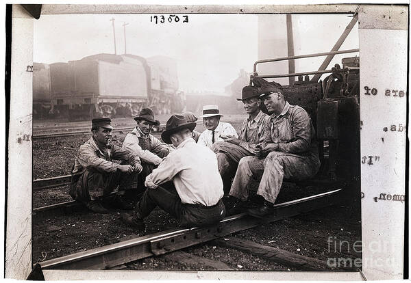 People Poster featuring the photograph Union Men Talking In Train Yard by Bettmann
