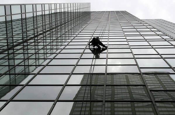 Working Poster featuring the photograph Window Washer by Filo