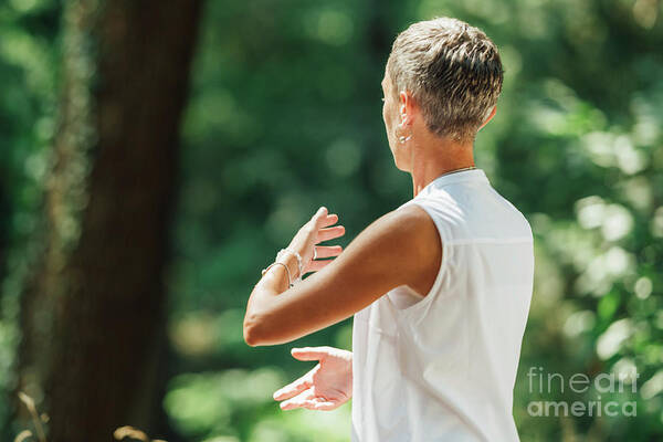Tai Chi Poster featuring the photograph Woman Practicing Tai Chi by Microgen Images/science Photo Library