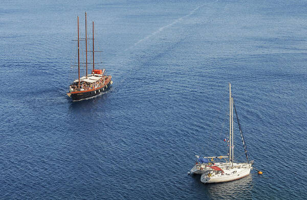 Sailing Poster featuring the photograph Yachts sailing on a blue calm sea by Michalakis Ppalis