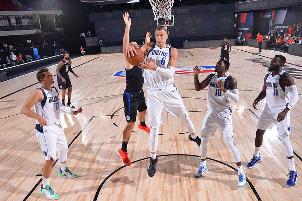 Kristaps Porzingis Poster featuring the photograph Dallas Mavericks v LA Clippers - Game One #1 by David Sherman