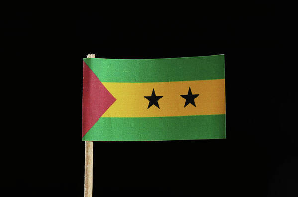 Sao Tomé And Príncipe Poster featuring the photograph A official flag of Sao Tom and Principe on toothpick on black background. by Vaclav Sonnek