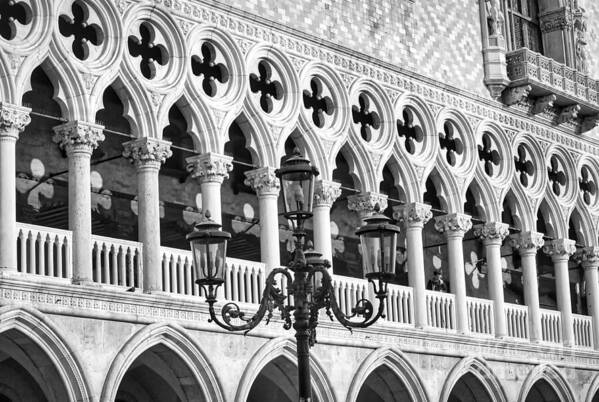 The Ducal Palace Poster featuring the photograph A typical Venetian street lamp in front of the Ducal Palace windows by Stefano Senise