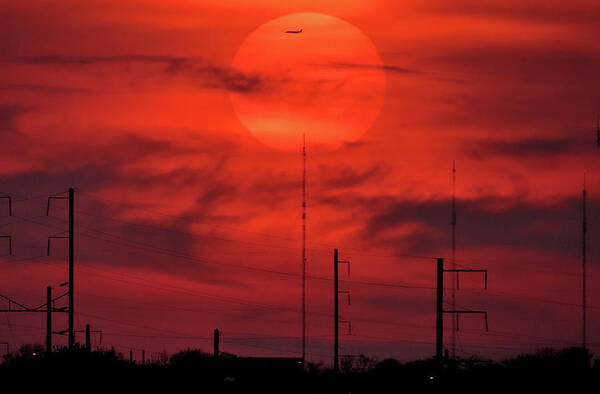 Sunset Poster featuring the photograph Airplane Passing in Front of Setting Sun Over Philadelphia by Linda Stern