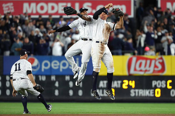 Playoffs Poster featuring the photograph Brett Gardner, Aaron Judge, and Aaron Hicks by Al Bello