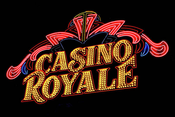 Casino Royale Hotel Sign At Night Poster featuring the photograph Casino Royale Sign by Az Jackson