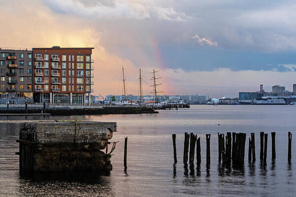 Boston Poster featuring the photograph East Boston Rainbow Sunset Rainbow Through the Pilings by Toby McGuire