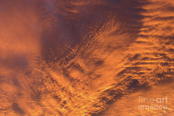 Clouds Poster featuring the photograph Glowing sunset sky with deep orange clouds by Adriana Mueller