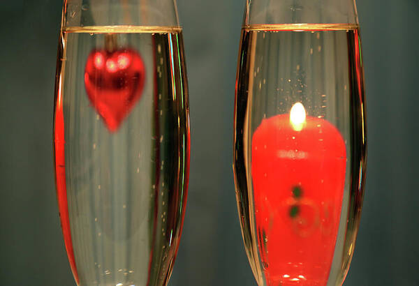 Champagne Poster featuring the photograph Heart And Candle In Glasses With Champagne by Mikhail Kokhanchikov