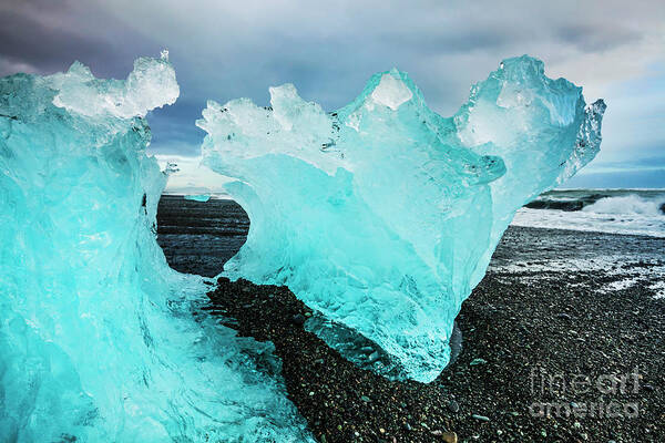 Diamond Beach Poster featuring the photograph Icebergs on Jokulsarlon black beach, Iceland by Neale And Judith Clark