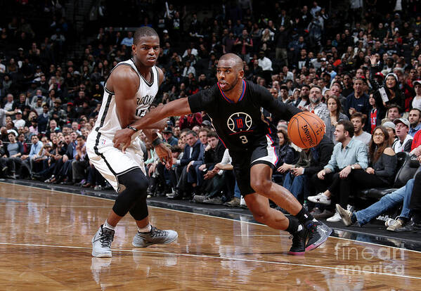 Chris Paul Poster featuring the photograph Isaiah Whitehead and Chris Paul by Nathaniel S. Butler