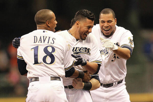 Celebration Poster featuring the photograph Khris Davis, Wily Peralta, and Yovani Gallardo by Mike Mcginnis