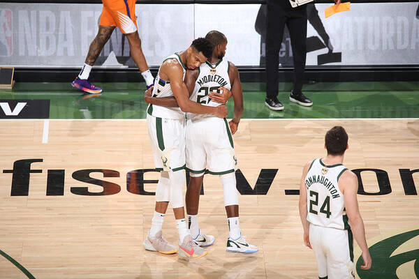 Giannis Antetokounmpo Poster featuring the photograph Khris Middleton and Giannis Antetokounmpo by Gary Dineen