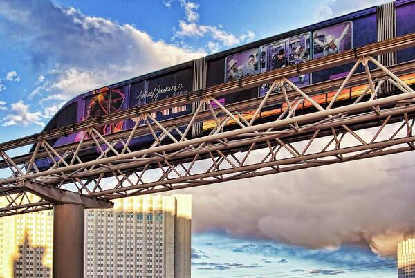 Las Vegas Monorail Poster featuring the photograph Las Vegas Monorail riding above the city by Tatiana Travelways
