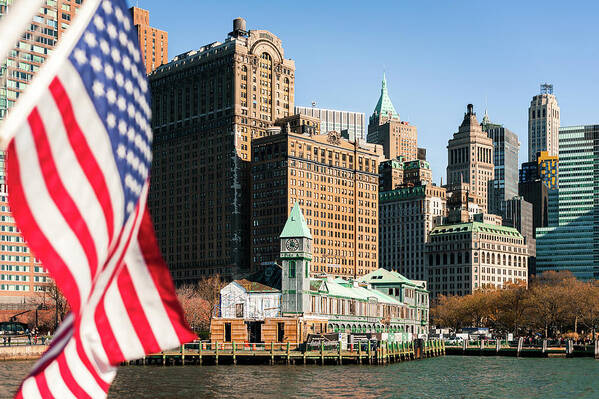 Flag Poster featuring the photograph Manhattan and american flag by Philippe Lejeanvre