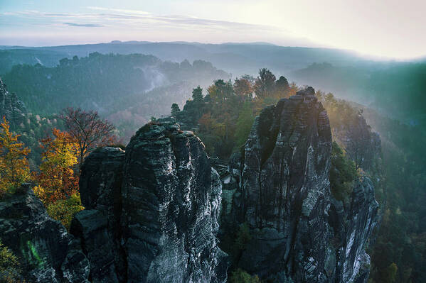 Saxon Switzerland Poster featuring the photograph Morning mist on the Bastei rocks in Saxon Switzerland by Sun Travels