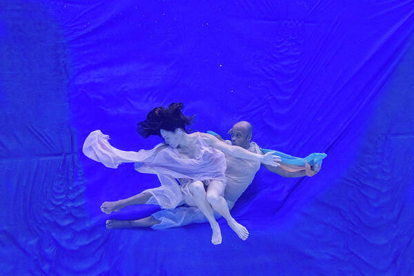 Nina Poster featuring the photograph Nina and General dancing underwater in front of blue background 8 by Dan Friend