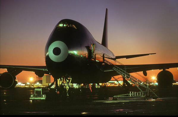 Northwest Orient Airlines Poster featuring the photograph Northwest Orient Airlines Boeing 747 Under the Lights by Erik Simonsen