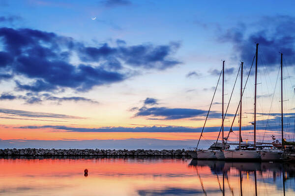 Sailboat Poster featuring the photograph Reflection of sailboats at sunset in Kalamaria by Alexios Ntounas