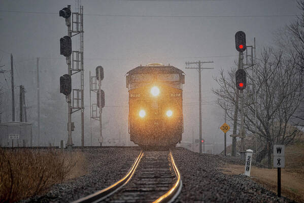 Railroad Poster featuring the photograph Southbound CSX at Mortons Junction during a snow squaw by Jim Pearson