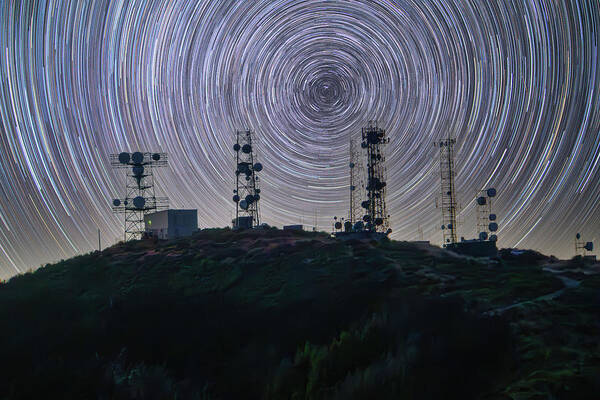 Star Trails Poster featuring the photograph Star Trails Over Radio Towers by Lindsay Thomson