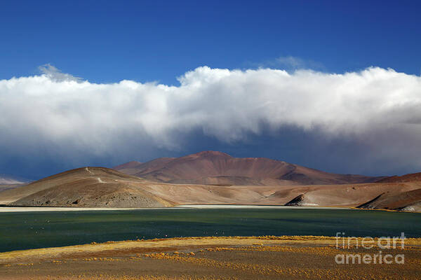 Chile Poster featuring the photograph Storm cloud rising above Laguna Santa Rosa Chile by James Brunker