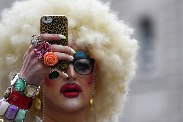 Lgbt Poster featuring the photograph Taking a selfie during Pride in London 2019 by Andrew Lalchan